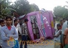 26 killed as bus falls off a bridge after collision.