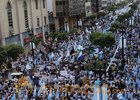 Opponents of Ecuador's president stage huge march in biggest city to protest economic policies