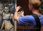 Russian police seize painting of Putin, Medvedev in women's underwear  