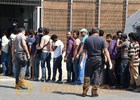 Survivors tell police in Sicily some 200 migrants were kept inside capsized boat by smugglers